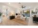 Main bedroom with a neutral color scheme, a ceiling fan, and a sliding glass door view of the pool at 8254 E Juan Tabo Rd, Scottsdale, AZ 85255