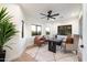 Home office with a modern desk, neutral carpet, and desert views from the windows at 8254 E Juan Tabo Rd, Scottsdale, AZ 85255