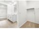 Bright bathroom boasts double sinks, vanity, and a walk-in closet at 8555 W Trenton Ct, Florence, AZ 85132