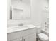 Bright bathroom with modern vanity, sink, mirror, and a bathtub with shower at 8555 W Trenton Ct, Florence, AZ 85132