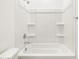 Bright bathroom featuring a clean, white shower-tub combo and modern fixtures at 8555 W Trenton Ct, Florence, AZ 85132
