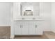 Elegant bathroom with double sink vanity featuring bright white cabinetry at 8555 W Trenton Ct, Florence, AZ 85132