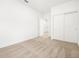 Spacious bedroom with plush carpeting, closet with sliding doors and an open door to another room at 8555 W Trenton Ct, Florence, AZ 85132