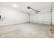 Spacious two-car garage featuring an automatic door opener and ample room for parking and storage at 8555 W Trenton Ct, Florence, AZ 85132
