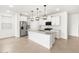 Spacious kitchen with modern appliances, a large island, and pendant lighting; a perfect space for entertaining at 8555 W Trenton Ct, Florence, AZ 85132