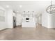 A modern kitchen with island seating is open to the spacious living area at 8555 W Trenton Ct, Florence, AZ 85132