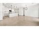 Open floor plan featuring tile flooring and a kitchen island with seating at 8555 W Trenton Ct, Florence, AZ 85132
