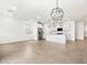 Spacious living area opens to a modern kitchen with stainless steel appliances at 8555 W Trenton Ct, Florence, AZ 85132