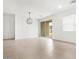 Bright living room featuring neutral tile flooring and sliding glass doors at 8555 W Trenton Ct, Florence, AZ 85132