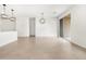 Living area with pendant lighting and sliding glass doors to outdoor space at 8555 W Trenton Ct, Florence, AZ 85132