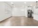 Bright and open living space with tile flooring leading to the kitchen at 8555 W Trenton Ct, Florence, AZ 85132