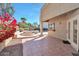 Relaxing backyard with a covered patio, swimming pool, spa, and lush tropical foliage at 9372 E Aster Dr, Scottsdale, AZ 85260