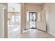 Welcoming entryway featuring neutral tile flooring and a decorative security door at 9372 E Aster Dr, Scottsdale, AZ 85260