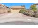 Charming single-story home featuring a two-car garage, desert landscaping, and a tile roof at 9372 E Aster Dr, Scottsdale, AZ 85260