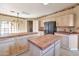 Open kitchen showcasing tile countertops, modern appliances, and a large island at 9372 E Aster Dr, Scottsdale, AZ 85260