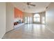 Bright living room with a fireplace, ceiling fan, and large windows, offering great light at 9372 E Aster Dr, Scottsdale, AZ 85260