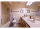 Bathroom showcases a tub and shower combination with a wood vanity and stylish mirror at 100 N Vulture Mine Rd # 103, Wickenburg, AZ 85390