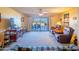 Cozy living room with a ceiling fan, tile floors, and sliding doors to the outdoor patio at 100 N Vulture Mine Rd # 103, Wickenburg, AZ 85390