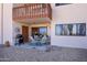 Rear patio features outdoor seating with a grill, covered seating area, and desert landscape at 100 N Vulture Mine Rd # 103, Wickenburg, AZ 85390