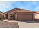 Charming single-story home featuring a tile roof, low-maintenance landscaping, and a two-car garage at 1146 N 89Th St, Mesa, AZ 85207