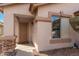 Inviting front entryway with decorative stone accents, screened door, and manicured landscaping at 1146 N 89Th St, Mesa, AZ 85207