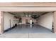 Spacious garage with epoxy flooring and ample storage space for vehicles and equipment at 1146 N 89Th St, Mesa, AZ 85207