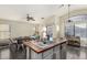 The kitchen island offers seating and features a butcher block countertop, overlooking the dining area at 1146 N 89Th St, Mesa, AZ 85207