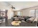 Spacious living room featuring modern decor, a ceiling fan, and ample natural light at 1146 N 89Th St, Mesa, AZ 85207