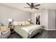 Cozy bedroom with a ceiling fan, closet, and sitting area at 1146 N 89Th St, Mesa, AZ 85207