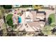 Expansive aerial view of estate home featuring a backyard pool, stone patio and manicured landscaping at 11628 S Warcloud Ct, Phoenix, AZ 85044