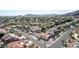 Neighborhood aerial view showcasing mature trees, desert landscaping, and many red tile roofs at 11628 S Warcloud Ct, Phoenix, AZ 85044