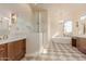 Elegant bathroom with a free-standing tub, glass shower, and double vanities at 11628 S Warcloud Ct, Phoenix, AZ 85044