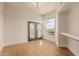 Bedroom with hardwood floors and french doors leading to the balcony and lots of natural light at 11628 S Warcloud Ct, Phoenix, AZ 85044