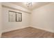 Bright bedroom features wood-look floors, recessed lighting, and neutral paint at 11628 S Warcloud Ct, Phoenix, AZ 85044