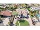 Aerial view of home's exterior elevation showcases front yard landscaping and covered entry at 11628 S Warcloud Ct, Phoenix, AZ 85044