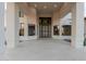 Grand entrance featuring an elegant doorway, natural light, and tile flooring at 11628 S Warcloud Ct, Phoenix, AZ 85044