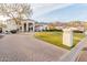 Elegant home with manicured lawn, beautiful lamp post, and lovely landscaping at 11628 S Warcloud Ct, Phoenix, AZ 85044