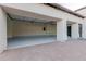 Attached garage with an abundance of space, painted floor, and electric door opener at 11628 S Warcloud Ct, Phoenix, AZ 85044