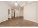 Spacious living room featuring wood-look floors, recessed lighting, and light paint at 11628 S Warcloud Ct, Phoenix, AZ 85044