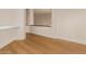 Living room with hardwood floors, white walls, and a contemporary design at 11628 S Warcloud Ct, Phoenix, AZ 85044