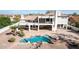 An elevated view of the home showcasing the pool with spa, stone details, and desert landscaping at 11628 S Warcloud Ct, Phoenix, AZ 85044