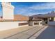 Expansive roof deck showcasing white stucco walls and red tile roofing, offering space to unwind at 11628 S Warcloud Ct, Phoenix, AZ 85044