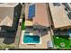 Aerial shot of backyard with a pool and green turf, ideal for outdoor activities and relaxation at 11954 W Melinda Ln, Sun City, AZ 85373