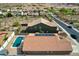 Aerial view of the backyard featuring a sparkling pool, perfect for relaxation and entertainment at 11954 W Melinda Ln, Sun City, AZ 85373