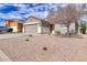 Single-story home featuring a desert landscape, neutral color palette, two-car garage, and tile roofing under a bright blue sky at 11954 W Melinda Ln, Sun City, AZ 85373