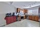 Well-lit kitchen featuring stainless steel appliances, granite countertops, and custom cabinetry under a bright, natural light at 11954 W Melinda Ln, Sun City, AZ 85373