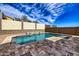 Swimming pool with decorative water feature and stone tile surround at 11954 W Melinda Ln, Sun City, AZ 85373