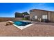 Swimming pool with desert landscaping in a private backyard setting at 11954 W Melinda Ln, Sun City, AZ 85373