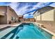 Wide shot of pool area, with shed and privacy wall at 11954 W Melinda Ln, Sun City, AZ 85373