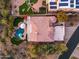 Aerial view of estate featuring private pool, landscaped yard, tile roof, and patio at 12026 N 138Th St, Scottsdale, AZ 85259